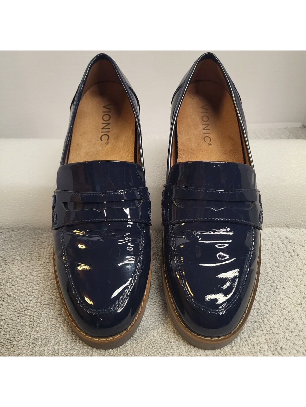 Vionic Cheryl II blue patent leather slip-on loafer showcasing a glossy finish